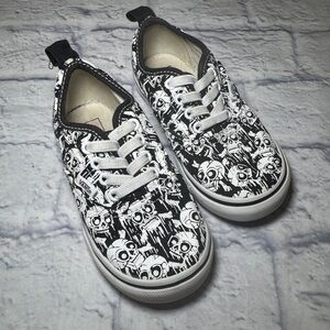 Vans Toddler Sz 8.5 Skull Slip On Shoes in Black and White.